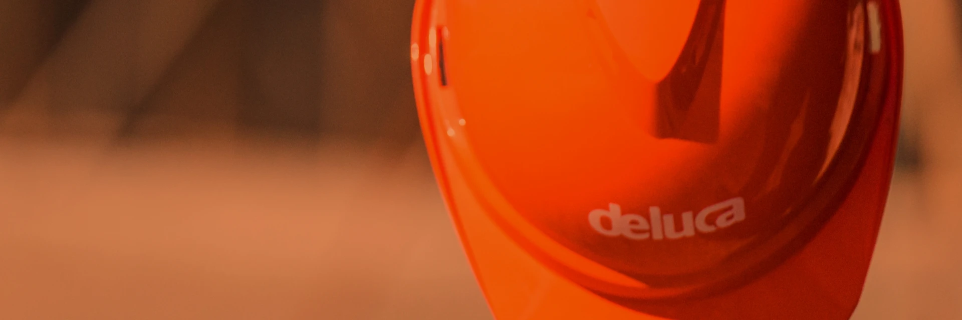 Deluca rebrand brand mark on hard hat