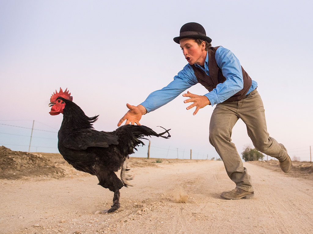 Outback Pioneers Jeremy Kinnon chasing a rooster